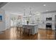 Bright and airy kitchen boasts an island with seating, stainless steel appliances, and a breakfast nook with great light at 15628 Waterfront Dr, Huntersville, NC 28078