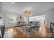 Bright living room featuring a decorative fireplace, hardwood floors, and large windows with natural light at 15628 Waterfront Dr, Huntersville, NC 28078