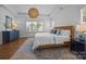 Bright main bedroom featuring a large bed, side table, and an area rug at 15628 Waterfront Dr, Huntersville, NC 28078