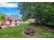 Backyard has a patio with an umbrella and a fire pit at 1668 Tate Rd, Rock Hill, SC 29732