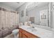 Well-lit bathroom featuring a decorative shower curtain and wood vanity at 1668 Tate Rd, Rock Hill, SC 29732