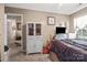 A comfortable bedroom with carpet flooring, white trim, and abundant natural light at 1668 Tate Rd, Rock Hill, SC 29732