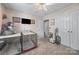 Bedroom with neutral carpet, bright natural light and abundant closet space at 1668 Tate Rd, Rock Hill, SC 29732
