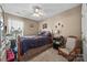 A cozy bedroom provides a comfortable retreat with neutral tones and ceiling fan at 1668 Tate Rd, Rock Hill, SC 29732