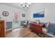 Charming dining area with a rustic wooden table, chairs, and a view to the backyard at 1668 Tate Rd, Rock Hill, SC 29732