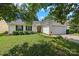 Inviting single-story home with a well-kept lawn, garage, and manicured shrubbery at 1668 Tate Rd, Rock Hill, SC 29732