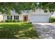 Charming single-story home with well-manicured lawn and attached two-car garage at 1668 Tate Rd, Rock Hill, SC 29732