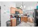 A bright kitchen is equipped with granite counters, tile backsplash, and stainless appliances at 1668 Tate Rd, Rock Hill, SC 29732