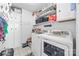 Spacious laundry room with washer, dryer, shelving and ample storage space at 1668 Tate Rd, Rock Hill, SC 29732
