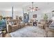 Cozy living room with plush seating, a ceiling fan, and a blend of neutral and blue tones at 1668 Tate Rd, Rock Hill, SC 29732