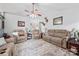 Spacious living room with neutral-toned furniture, a ceiling fan, and decorative accents at 1668 Tate Rd, Rock Hill, SC 29732