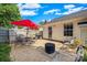 Backyard patio includes a table, chairs, a grill, and a black fire pit at 1668 Tate Rd, Rock Hill, SC 29732