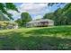 Expansive backyard with a covered deck, offering ample space for outdoor activities and gatherings at 1782 Oakdale Rd, Rock Hill, SC 29730