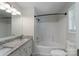Well-lit bathroom featuring a vanity with granite countertop and shower-tub combination at 1782 Oakdale Rd, Rock Hill, SC 29730