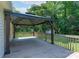 Well-maintained deck featuring a covered gazebo with a view of the green backyard and storage shed at 1782 Oakdale Rd, Rock Hill, SC 29730
