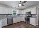 Modern kitchen featuring stainless steel appliances, granite countertops, and white cabinets at 1782 Oakdale Rd, Rock Hill, SC 29730