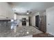 Bright kitchen featuring granite counters, stainless steel appliances, and gray subway tile backsplash at 1782 Oakdale Rd, Rock Hill, SC 29730