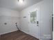 Functional laundry room features a utility sink and exterior access at 1782 Oakdale Rd, Rock Hill, SC 29730