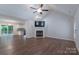 Spacious living room with a fireplace, new flooring, and seamless flow to the kitchen at 1782 Oakdale Rd, Rock Hill, SC 29730