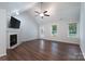 Inviting living room with a fireplace, new flooring, and plenty of natural light at 1782 Oakdale Rd, Rock Hill, SC 29730