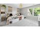 Bright bedroom with two twin beds, decorative tapestry wall hangings and lots of natural light at 2010 Brightflower Ln, York, SC 29745