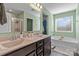 Spa-like bathroom with dual sinks, soaking tub, and walk-in shower at 210 Clove Hitch Dr, Statesville, NC 28677