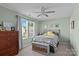 Calm bedroom featuring a ceiling fan, natural light and neutral color scheme at 210 Clove Hitch Dr, Statesville, NC 28677