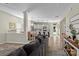 Open-concept dining area with modern lighting, wood floors, and seamless flow to the kitchen at 210 Clove Hitch Dr, Statesville, NC 28677