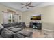 Inviting living room features a large sectional sofa, a ceiling fan, and a media center at 210 Clove Hitch Dr, Statesville, NC 28677