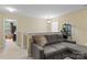 Upstairs bonus room featuring a comfortable sofa and adjacent bonus room at 210 Clove Hitch Dr, Statesville, NC 28677