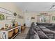 Comfortable living room with a large sectional sofa, wood floors, and decorative wall accents at 210 Clove Hitch Dr, Statesville, NC 28677