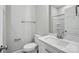 Modern bathroom showcasing a white vanity with quartz countertop and toilet at 2732 Mayfair Ave, Charlotte, NC 28208