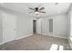 Spacious bedroom featuring neutral walls, carpet, ceiling fan, and ample natural light at 2732 Mayfair Ave, Charlotte, NC 28208
