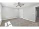 Neutral bedroom featuring a ceiling fan, carpet, and white trim at 2732 Mayfair Ave, Charlotte, NC 28208