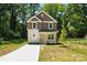 Charming two-story home with a modern exterior, neat lawn, and a newly poured concrete driveway at 2732 Mayfair Ave, Charlotte, NC 28208