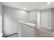 Upstairs hallway features neutral carpet and leads to a bedroom at 2732 Mayfair Ave, Charlotte, NC 28208