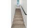 Carpeted staircase with a black railing leads to the upper level at 2732 Mayfair Ave, Charlotte, NC 28208
