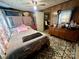 Well-lit bedroom featuring carpet, a bed, and storage spaces at 302 Margarette Ave, Belmont, NC 28012