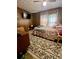 Bedroom featuring carpet, bed, and a view of the installed TV at 302 Margarette Ave, Belmont, NC 28012