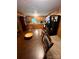 Functional kitchen with wood cabinets, a standard black refrigerator, and a dining table at 302 Margarette Ave, Belmont, NC 28012