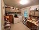 Laundry room offering storage cabinets, a sink, and washer/dryer at 302 Margarette Ave, Belmont, NC 28012