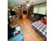 Inviting living room featuring wood-look floors and comfortable seating arrangement at 302 Margarette Ave, Belmont, NC 28012