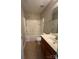 Bright bathroom featuring a shower-tub combo, vanity with a sink, and tiled floor at 3022 Hendricks Chapel Ln, Charlotte, NC 28216