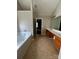 Bathroom featuring soaking tub, tile floors and double sink at 3022 Hendricks Chapel Ln, Charlotte, NC 28216