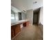 Spacious bathroom with double vanity, bathtub, and tile flooring at 3022 Hendricks Chapel Ln, Charlotte, NC 28216