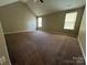 Spacious bedroom with vaulted ceiling and natural light from windows at 3022 Hendricks Chapel Ln, Charlotte, NC 28216