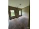 Neutral bedroom with carpet, and two windows that offer natural light at 3022 Hendricks Chapel Ln, Charlotte, NC 28216