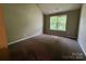 Bedroom featuring carpeted floors, one window offering natural light, and neutral walls at 3022 Hendricks Chapel Ln, Charlotte, NC 28216