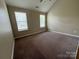 Neutral bedroom featuring carpeted floors, two windows and neutral walls at 3022 Hendricks Chapel Ln, Charlotte, NC 28216