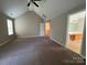 Large bedroom featuring vaulted ceilings with entry to the bathroom at 3022 Hendricks Chapel Ln, Charlotte, NC 28216